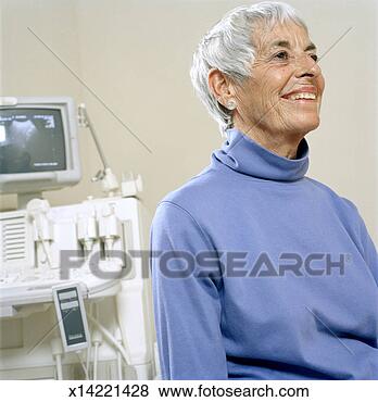 Stock Photo - senior woman in 
doctors office 
sitting in front 
of medical equipment. 
fotosearch - search 
stock photos, 
pictures, images, 
and photo clipart