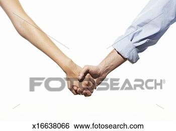 Stock Photo - mid adult couple 
holding hands, 
mid section. fotosearch 
- search stock 
photos, pictures, 
images, and photo 
clipart