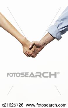 Stock Photo - mid adult couple 
holding hands, 
mid section. fotosearch 
- search stock 
photos, pictures, 
images, and photo 
clipart