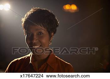 Stock Photo - mid adult woman 
outdoors at night, 
 backlit by source 
of light. fotosearch 
- search stock 
photos, pictures, 
images, and photo 
clipart