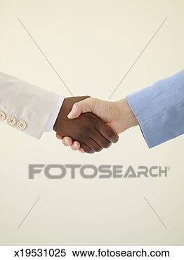 Stock Image - two people shaking 
hands, close-up 
of hands. fotosearch 
- search stock 
photos, pictures, 
images, and photo 
clipart