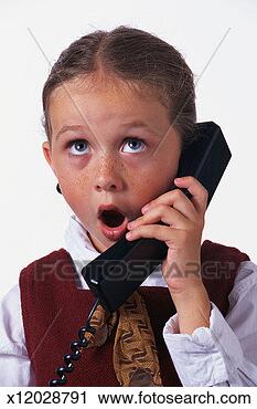 Stock Photography - girl with surprised 
expression using 
phone, looking 
upwards. fotosearch 
- search stock 
photos, pictures, 
images, and photo 
clipart