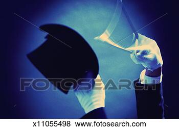 Stock Photo - magician's hands 
in white gloves 
tapping wand against 
top hat. fotosearch 
- search stock 
photos, pictures, 
images, and photo 
clipart