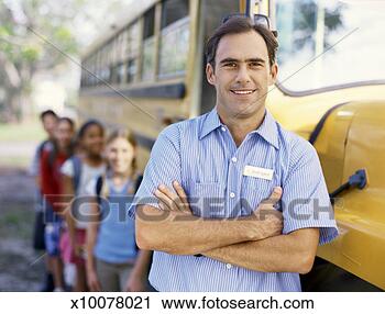 Stock Photography - portrait of a 
mid adult man 
near a school 
bus. fotosearch 
- search stock 
photos, pictures, 
images, and photo 
clipart