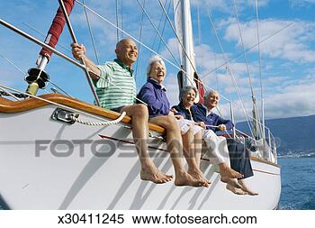 Stock Image - side profile of 
two senior men 
with two senior 
women on a sailboat. 
fotosearch - search 
stock photos, 
pictures, images, 
and photo clipart