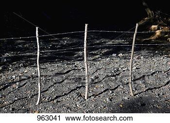 Stock Photography - detail of a barbed 
wire fence at 
night. fotosearch 
- search stock 
photos, pictures, 
wall murals, images, 
and photo clipart