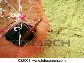Stock Photography - an umbrella over 
a laptop. fotosearch 
- search stock 
photos, pictures, 
images, and photo 
clipart