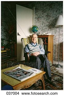 Stock Photo - an old man sitting 
in a rocking chair 
in his living 
room. fotosearch 
- search stock 
photos, pictures, 
images, and photo 
clipart