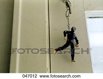 Stock Photo - a scuba diver 
keychain hanging 
from a door lock. 
fotosearch - search 
stock photos, 
pictures, images, 
and photo clipart