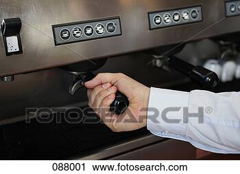 Stock Photography - close-up of barista 
using an espresso 
machine. fotosearch 
- search stock 
photos, pictures, 
images, and photo 
clipart