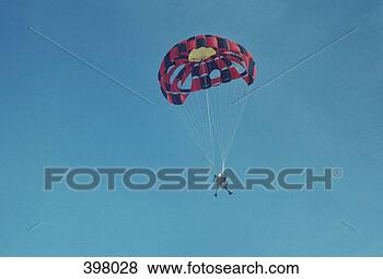 Stock Photo - man parachute 
jumping. fotosearch 
- search stock 
photos, pictures, 
images, and photo 
clipart