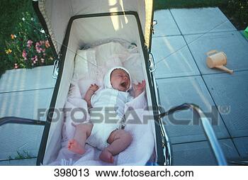 Stock Photo - newborn baby yawning 
in a pram. fotosearch 
- search stock 
photos, pictures, 
images, and photo 
clipart
