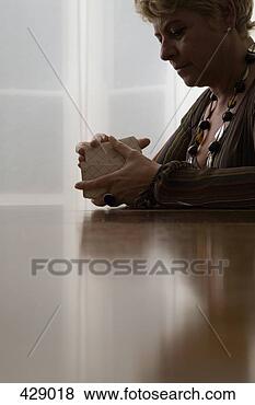 Stock Photo - a woman shuffling 
tarot cards. fotosearch 
- search stock 
photos, pictures, 
images, and photo 
clipart