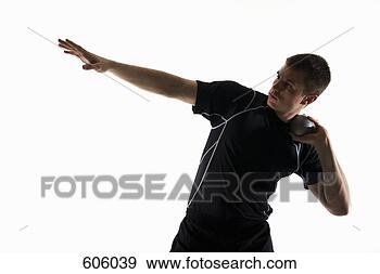 Stock Photograph - studio shot of 
a male track and 
field athlete 
holding a shot 
put ball. fotosearch 
- search stock 
photos, pictures, 
images, and photo 
clipart