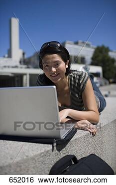 Stock Photo - a university student 
using a laptop. 
fotosearch - search 
stock photos, 
pictures, images, 
and photo clipart