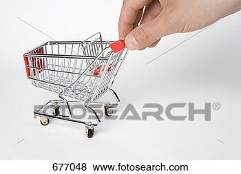 Stock Photo - a miniature empty 
shopping cart 
being pushed by 
human fingers. 
fotosearch - search 
stock photos, 
pictures, images, 
and photo clipart
