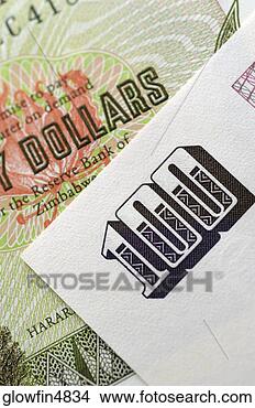 Stock Photo - zimbabwe bank 
note and paper 
with number 100, 
close-up. fotosearch 
- search stock 
photos, pictures, 
images, and photo 
clipart