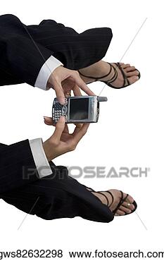 Stock Photo - high angle view 
of a businesswoman 
holding a mobile 
phone. fotosearch 
- search stock 
photos, pictures, 
images, and photo 
clipart