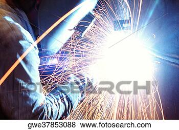 Stock Photo - side profile of 
a welder welding 
metal, chicago, 
illinois, usa. 
fotosearch - search 
stock photos, 
pictures, images, 
and photo clipart