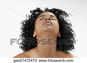 Stock Photo - close-up of a 
young woman with 
her eyes closed. 
fotosearch - search 
stock photos, 
pictures, images, 
and photo clipart