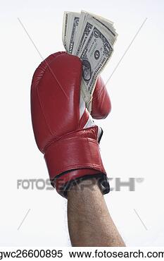 Stock Image - male boxer's hand 
holding us dollar 
bills. fotosearch 
- search stock 
photos, pictures, 
images, and photo 
clipart