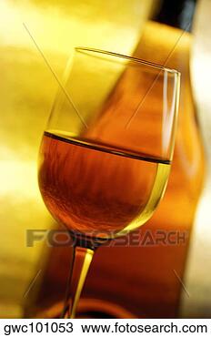 Stock Photo - close-up of a 
glass of wine 
in front of a 
wine bottle. fotosearch 
- search stock 
photos, pictures, 
images, and photo 
clipart