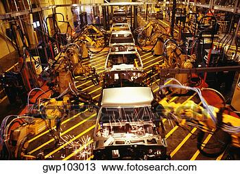 Stock Photo - high angle view 
of robots at work 
in a plant,  gmc 
truck plant. fotosearch 
- search stock 
photos, pictures, 
images, and photo 
clipart