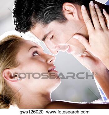 Stock Photography - close-up of a 
young couple kissing. 
fotosearch - search 
stock photos, 
pictures, wall 
murals, images, 
and photo clipart