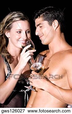 Picture - close-up of a 
young couple holding 
wineglasses. fotosearch 
- search stock 
photos, pictures, 
images, and photo 
clipart