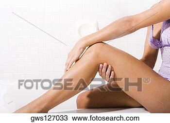 Stock Photo - low section view 
of a young woman 
sitting. fotosearch 
- search stock 
photos, pictures, 
images, and photo 
clipart