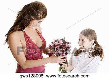 Stock Image - high angle view 
of a girl giving 
her mother a bunch 
of flowers. fotosearch 
- search stock 
photos, pictures, 
images, and photo 
clipart