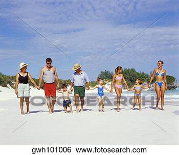 Stock Photo - three generation 
family walking 
on the beach with 
holding hands. 
fotosearch - search 
stock photos, 
pictures, images, 
and photo clipart