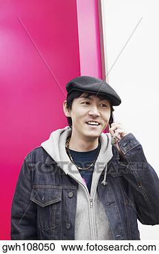 Stock Photography - mid adult man 
talking on a mobile 
phone. fotosearch 
- search stock 
photos, pictures, 
images, and photo 
clipart