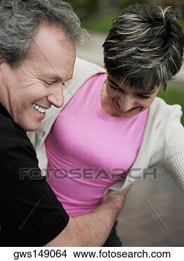 Stock Photo - close-up of a 
mature man embracing 
a mature woman 
and smiling. fotosearch 
- search stock 
photos, pictures, 
images, and photo 
clipart