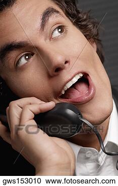 Stock Photography - close-up of a 
businessman talking 
on the telephone. 
fotosearch - search 
stock photos, 
pictures, images, 
and photo clipart