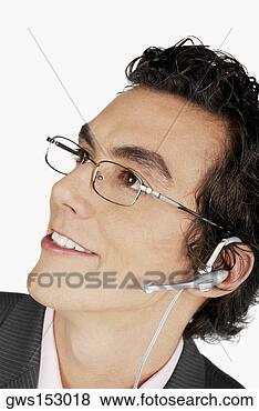Stock Photo - close-up of a 
businessman wearing 
a hands free device. 
fotosearch - search 
stock photos, 
pictures, images, 
and photo clipart
