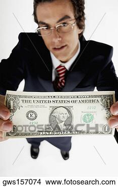 Stock Photo - portrait of a 
businessman holding 
an american dollar 
bill. fotosearch 
- search stock 
photos, pictures, 
images, and photo 
clipart