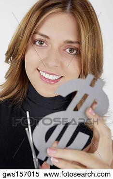 Stock Image - portrait of a 
businesswoman 
holding a dollar 
sign with a pair 
of. fotosearch 
- search stock 
photos, pictures, 
images, and photo 
clipart