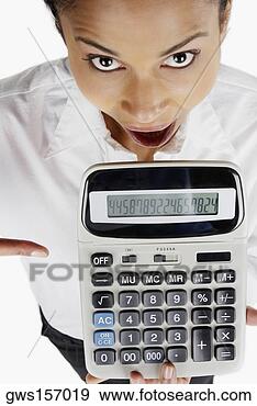 Stock Photograph - portrait of a 
businesswoman 
holding a calculator 
with her mouth 
open. fotosearch 
- search stock 
photos, pictures, 
images, and photo 
clipart