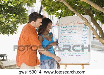Stock Photo - side profile of 
a mid adult man 
and a teenage 
girl looking at 
a menu. fotosearch 
- search stock 
photos, pictures, 
images, and photo 
clipart