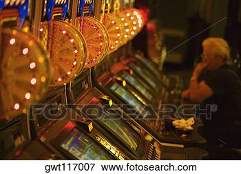 Picture - side profile of 
a person sitting 
in a casino, las 
vegas, nevada, 
usa. fotosearch 
- search stock 
photos, pictures, 
images, and photo 
clipart