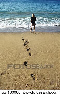 Stock Photography - a woman's footprints 
imprinted on the 
sand,  pigeon 
point beach. fotosearch 
- search stock 
photos, pictures, 
images, and photo 
clipart