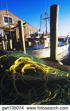 Stock Photo - boat moored at 
a dock, cape cod, 
massachusetts, 
usa. fotosearch 
- search stock 
photos, pictures, 
images, and photo 
clipart