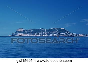 Stock Photo - rock formations 
at the waterfront, 
rock of gibraltar, 
gibraltar, spain. 
fotosearch - search 
stock photos, 
pictures, images, 
and photo clipart