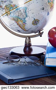 Stock Photo - close-up of a 
globe and a file 
on the table. 
fotosearch - search 
stock photos, 
pictures, images, 
and photo clipart