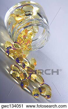 Stock Photography - close-up of vitamin 
e capsules spilling 
from a jar. fotosearch 
- search stock 
photos, pictures, 
images, and photo 
clipart