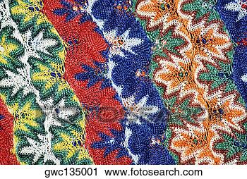 Stock Photography - close-up of a 
floral pattern 
on a woolen fabric. 
fotosearch - search 
stock photos, 
pictures, images, 
and photo clipart