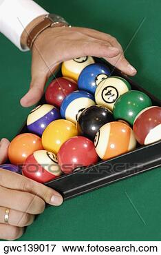 Picture - close-up of a 
person's hands 
racking up pool 
balls on a pool 
table. fotosearch 
- search stock 
photos, pictures, 
images, and photo 
clipart