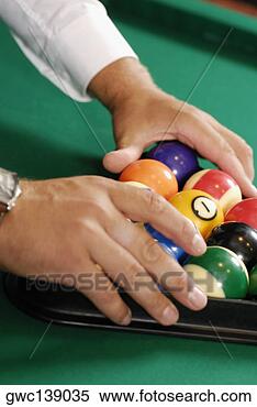 Stock Image - close-up of a 
person's hands 
racking up pool 
balls on a pool 
table. fotosearch 
- search stock 
photos, pictures, 
images, and photo 
clipart