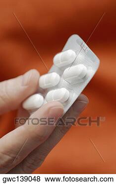 Stock Photo - close-up of a 
person's hand 
holding a blister 
pack. fotosearch 
- search stock 
photos, pictures, 
images, and photo 
clipart